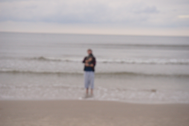 Me holding Dafne, out of focus; Gdańsk.