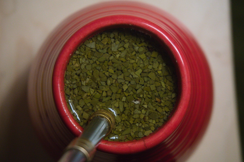 Green yerba mate in a red matero; Wrocław.