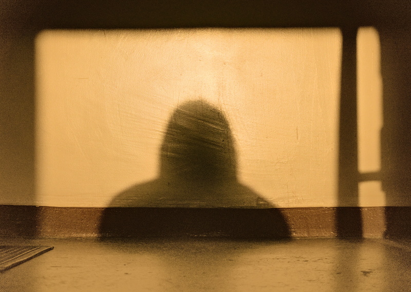 My shadow cast on a wall; Wrocław.